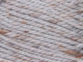 Close-up of a grey tweed yarn with visible fibers, indicating a blend of materials such as wool, acrylic, and viscose.